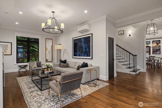 living area with baseboards, a wall unit AC, ornamental molding, dark wood-style flooring, and a chandelier