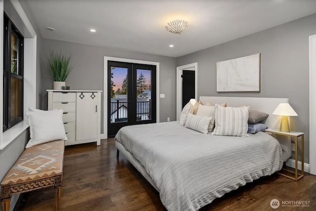 bedroom with access to exterior, recessed lighting, dark wood finished floors, and french doors