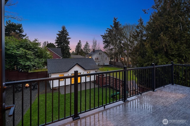 view of gate featuring a lawn and fence