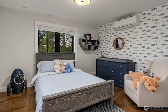 bedroom with dark wood-type flooring, an AC wall unit, and baseboards