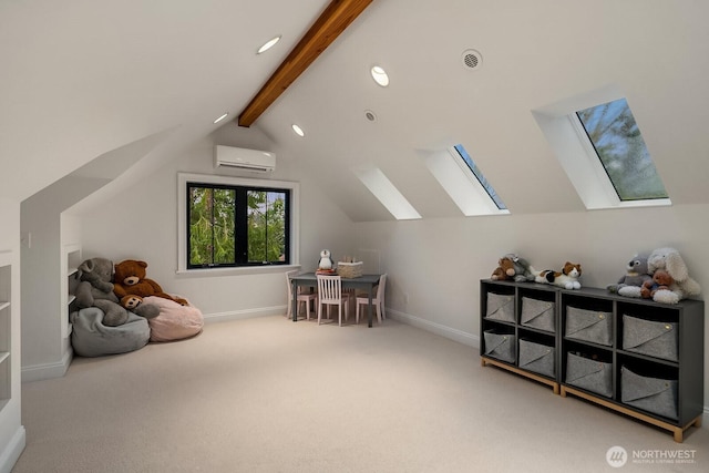 game room with vaulted ceiling with skylight, carpet flooring, visible vents, baseboards, and a wall mounted AC