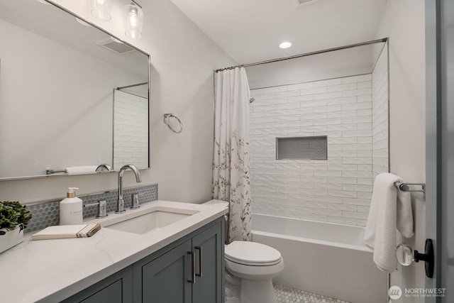 full bath with toilet, visible vents, shower / bath combination with curtain, and vanity