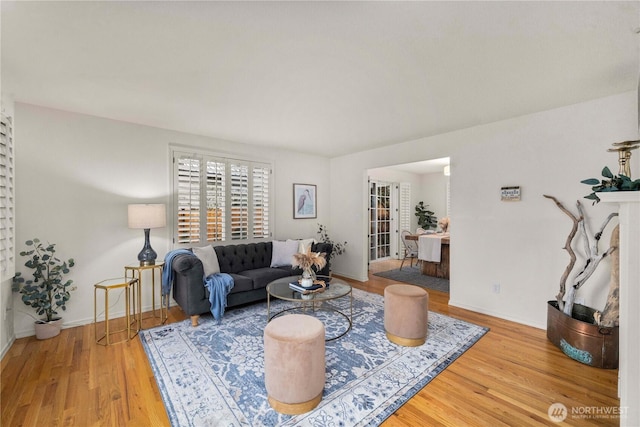 living area featuring wood finished floors and baseboards