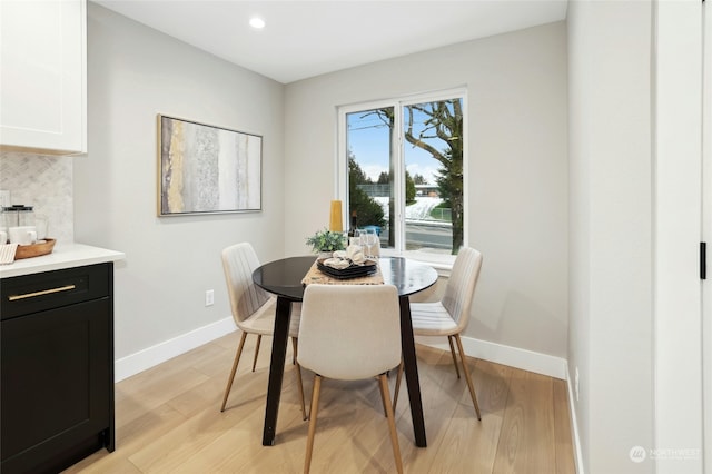 dining space featuring light wood-type flooring