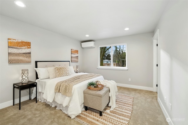 bedroom featuring light carpet and a wall unit AC