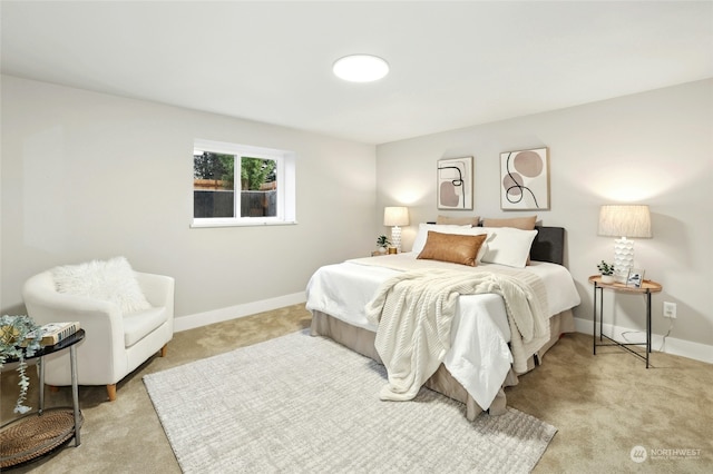 bedroom featuring light colored carpet