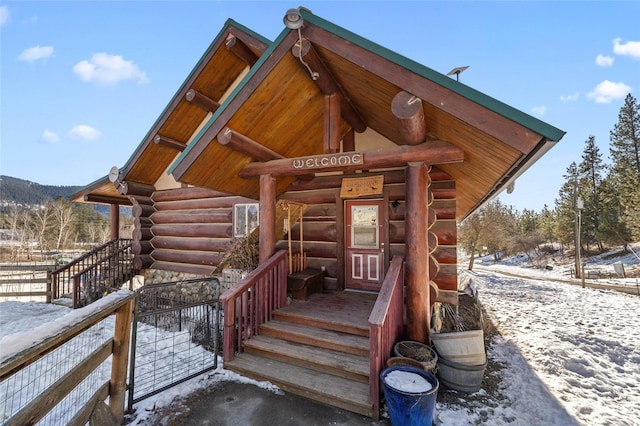 view of snow covered property entrance