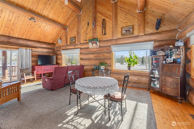 dining room with wood ceiling, beam ceiling, wood-type flooring, and high vaulted ceiling