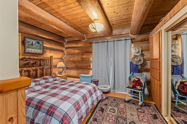 bedroom with beamed ceiling and wooden ceiling