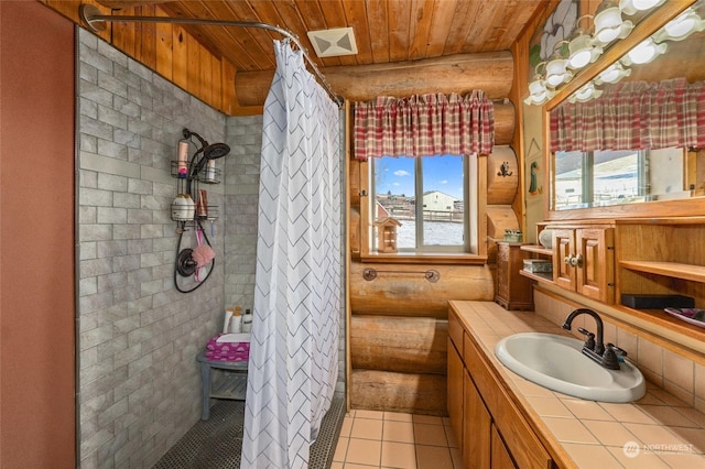 bathroom featuring rustic walls, vanity, walk in shower, wooden ceiling, and tile patterned floors