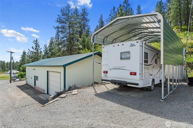 1427 N Chapin Rd, Evans, WA 99126 - view of parking / parking lot with a carport