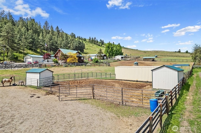 1427 N Chapin Rd, Evans, WA 99126 - view of yard featuring a view of countryside, an outdoor structure, an exterior structure, an outdoor riding arena, and an outbuilding