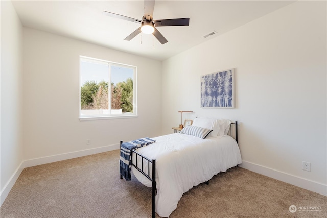 carpeted bedroom with ceiling fan