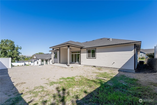 back of property with a patio area