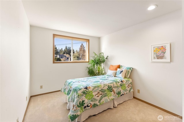 bedroom with recessed lighting, light colored carpet, and baseboards