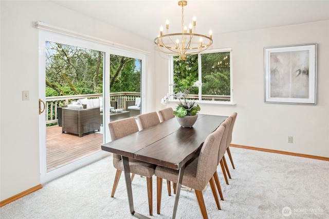 dining room featuring baseboards, light carpet, and a notable chandelier