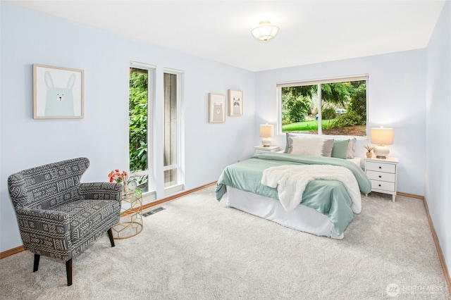 bedroom with visible vents, baseboards, and carpet flooring