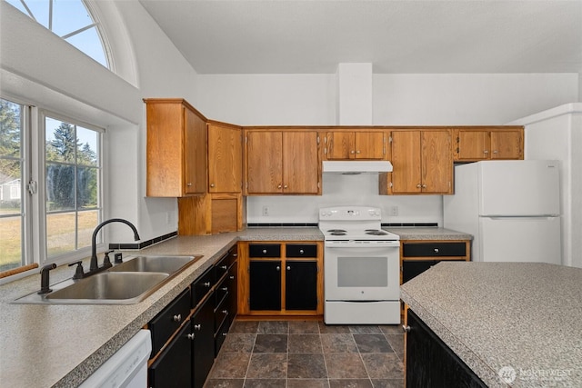 kitchen featuring white appliances and sink