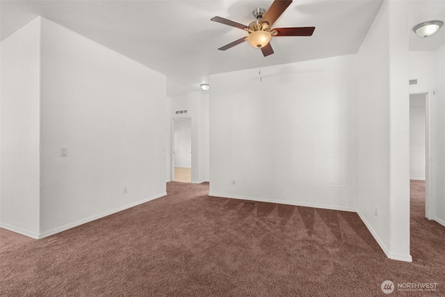 carpeted spare room with ceiling fan