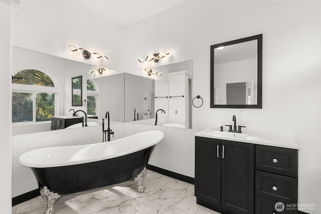 bathroom featuring a tub to relax in and vanity