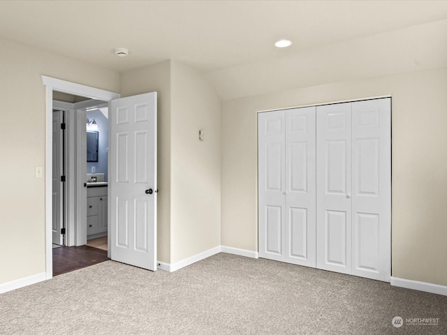 unfurnished bedroom with carpet flooring and a closet