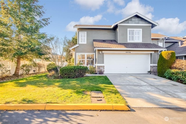 view of front facade with a garage and a front yard