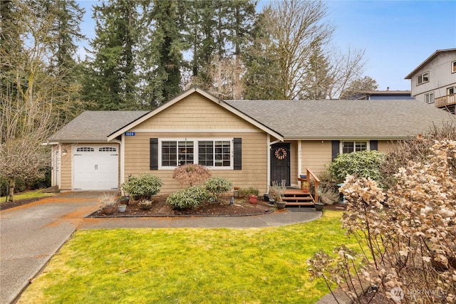 single story home featuring aphalt driveway, a front yard, a shingled roof, and an attached garage