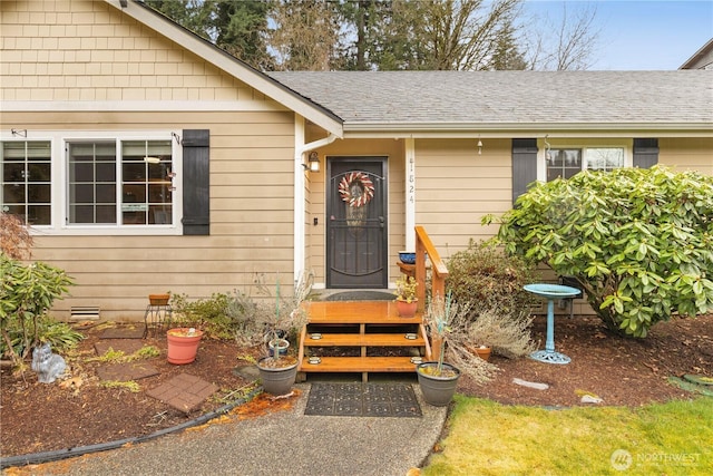 entrance to property with roof with shingles and crawl space