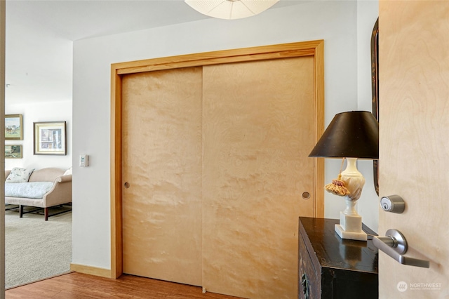 interior space featuring baseboards and wood finished floors