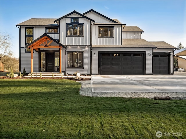 modern farmhouse featuring a garage and a front lawn