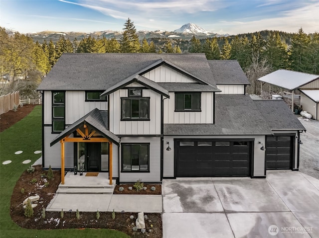 modern farmhouse featuring a mountain view and a garage