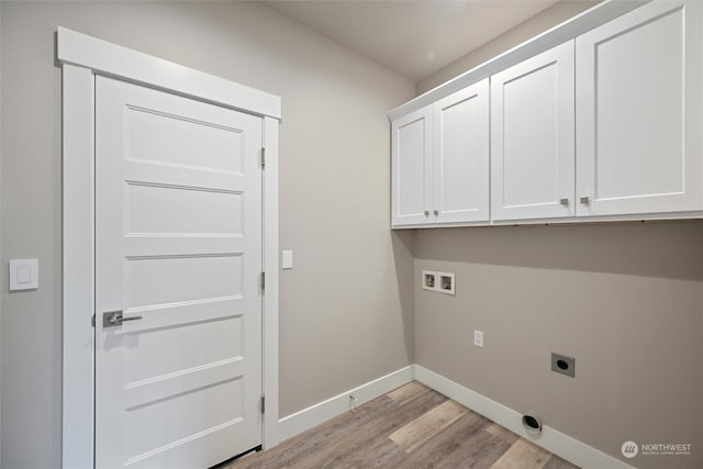 laundry area featuring cabinets, hookup for a washing machine, hookup for an electric dryer, and light wood-type flooring