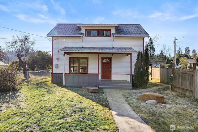 view of front of property featuring a front yard and covered porch