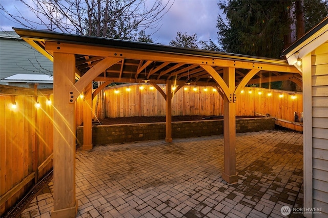 view of patio terrace at dusk