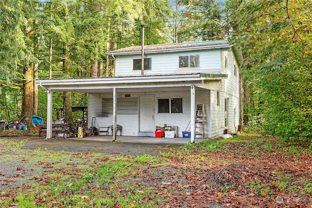 view of front of home featuring a carport