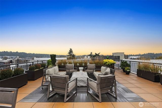 view of patio terrace at dusk