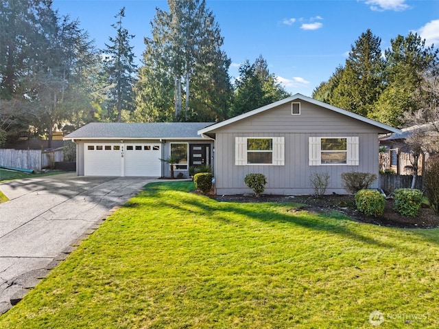 ranch-style home with a garage and a front yard