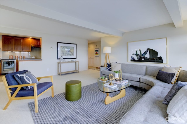 living room with beamed ceiling, beverage cooler, and light carpet