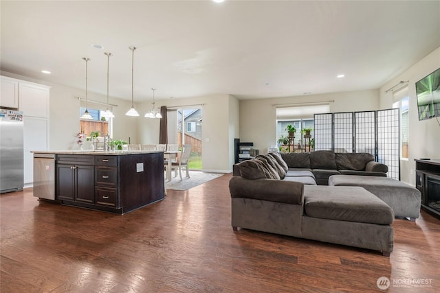 living room featuring dark wood-style floors and recessed lighting