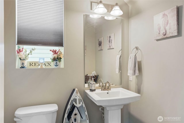 bathroom featuring toilet and a sink