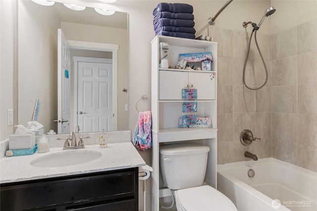 bathroom featuring vanity, toilet, and shower / bathtub combination