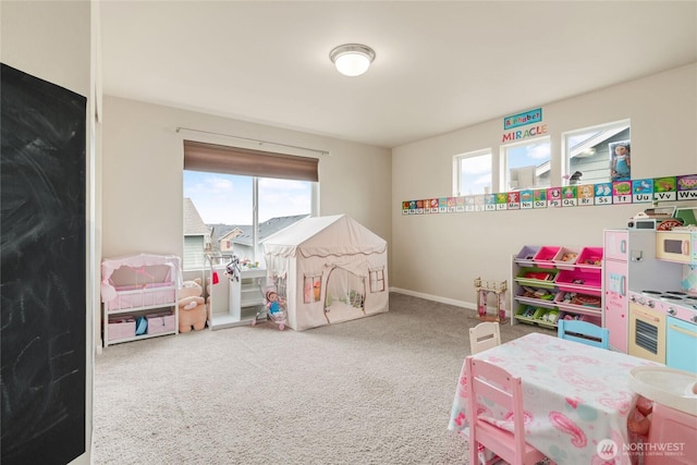 game room featuring carpet flooring and baseboards