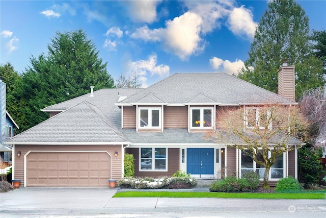 view of front of property with a garage