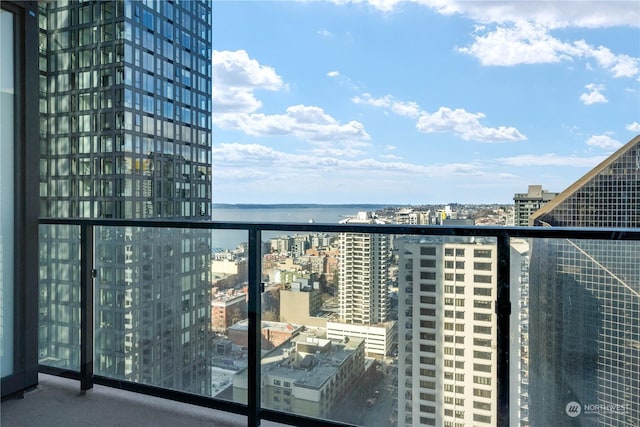 balcony featuring a water view