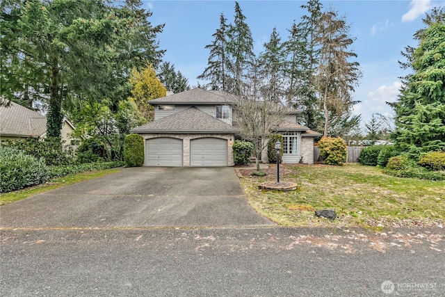 front of property with a garage and a front yard