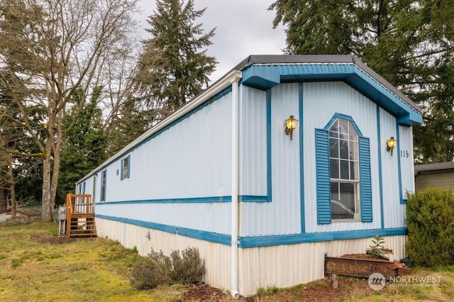 view of home's exterior featuring a lawn