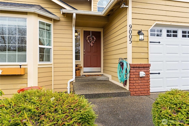 entrance to property with an attached garage