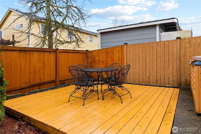 deck with fence and outdoor dining area