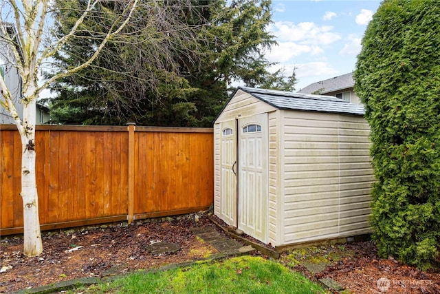 view of shed with fence