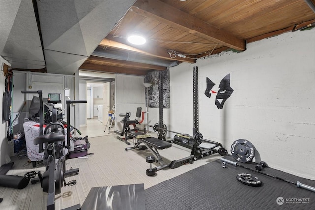 exercise room featuring wood ceiling